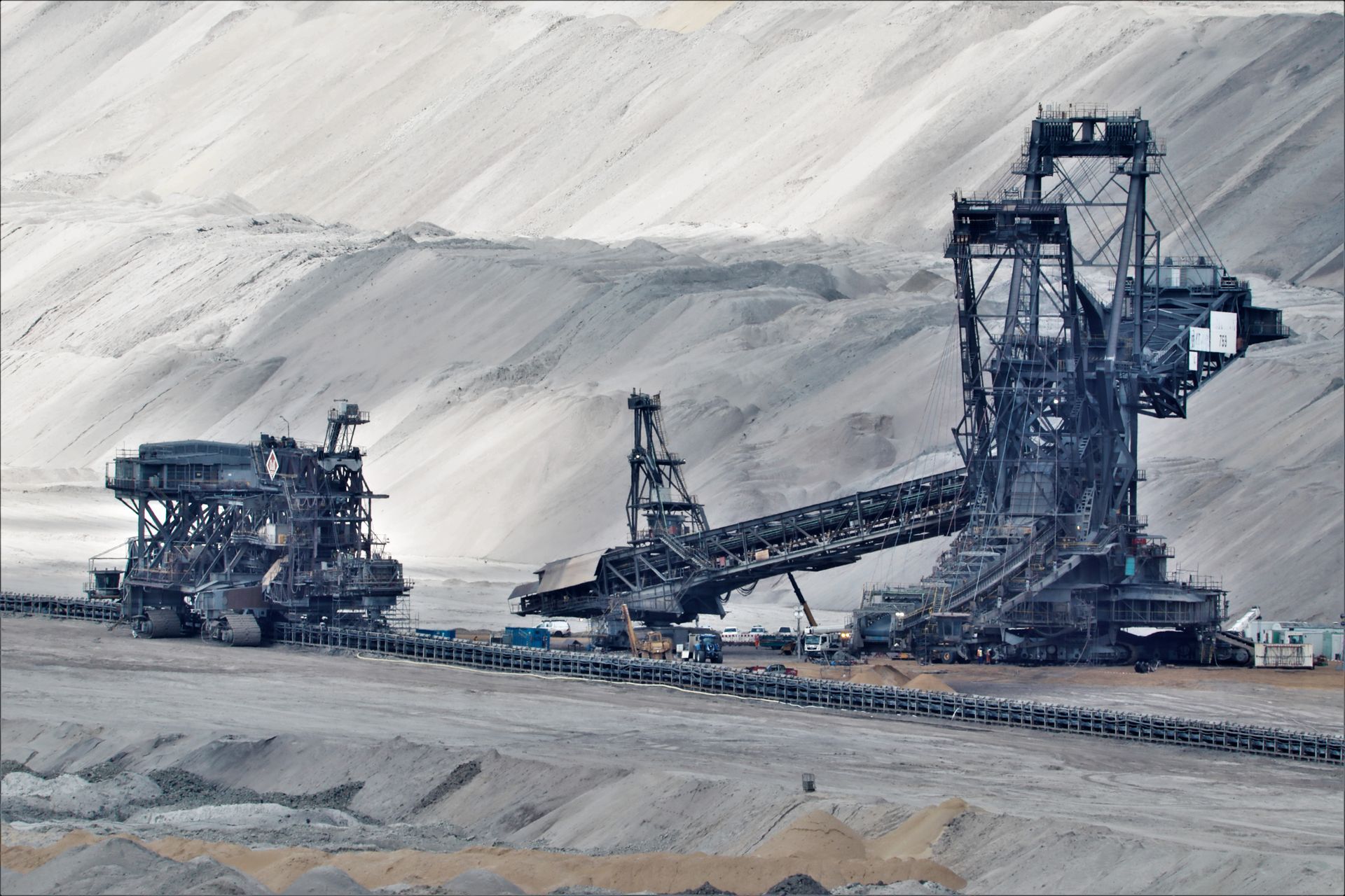 Bucket-wheel excavator and conveyors in an open-pit mine